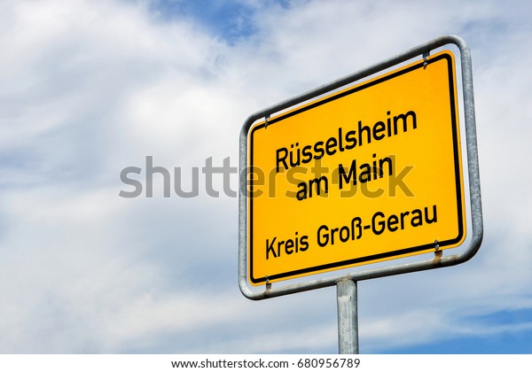 July 8 2017:  City sign of Rüsselsheim am\
Main. This german city is famous for car manufacturing and\
headquarters/birthplace of Adam Opel\
GmbH.
