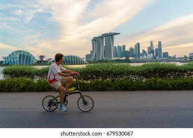 JULY 9, 2016: The Movement Of People In The Evening Sunset Time At Marina Bay Sand Park, The Most Famous Tourist Attraction In Singapore City, Singapore.