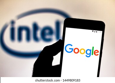 July 9, 2019, Brazil. In This Photo Illustration The Google Logo Is Displayed On A Smartphone. In The Background, Intel Corporation Logo.