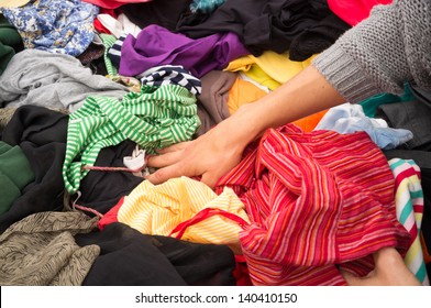 Jumble Sale Market Stall With Female Hands Rummaging