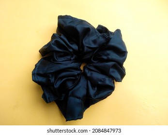 Jumbo Black Hair Tie On White Background In Hand