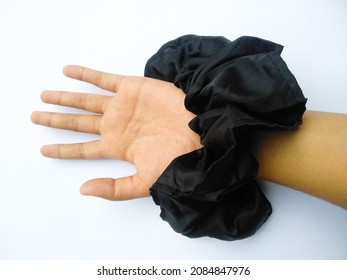 Jumbo Black Hair Tie On White Background In Hand