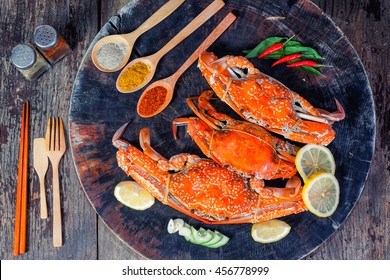 jumbo crab and spices herb on dark background 