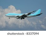 Jumbo is flying in a clouded sky.