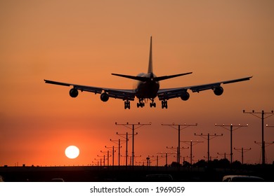 Jumbo Jet Coming In For A Sunset Landing