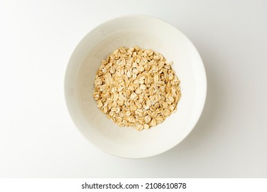 Jumbo Oats In A Bowl On White Background, Top View