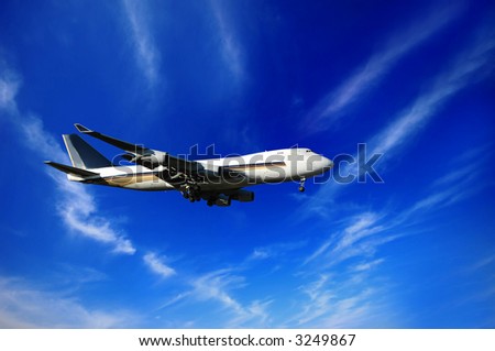 Jumbojet, blue sky and clouds