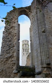 Jumieges Abbey, France - OCTOBER 20, 2016.  View of the tower through the window in the ruined wall of the ancient Benedictine medieval monastery