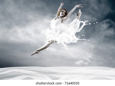 Jump of ballerina with dress of milk