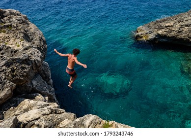 Jump from a cliff in mediterranean sea