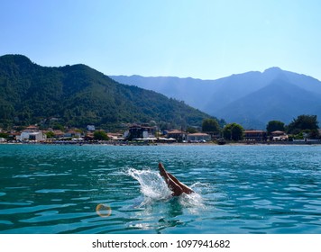 Jump Into Deep Blue Sea. Summer Vacation In Greek Island