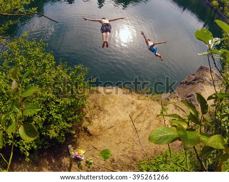 Similar – Image, Stock Photo Swimming fun at quarry pond, young adults swing into the water