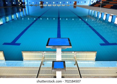 Jump platform for swimming in swimming pool and grandstand background - Powered by Shutterstock