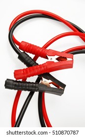 Jumper cables on plain background