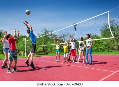 Jumping boy during volleyball game on the court
