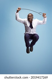 Jumping, Flying. One Funny Doctor, Therapeutic Or Medical Advisor Posing Isolated On Blue Studio Back Ground. Funny Meme Emotions. Concept Of Healthcare, Care, Medicine And Humor. Copy Space For Ad