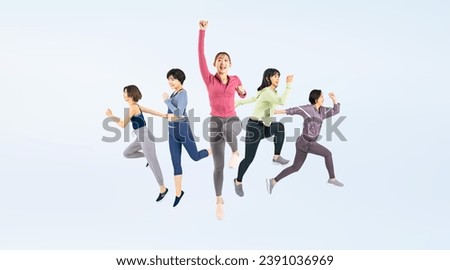 Jumping group of woman wearing sports wear.