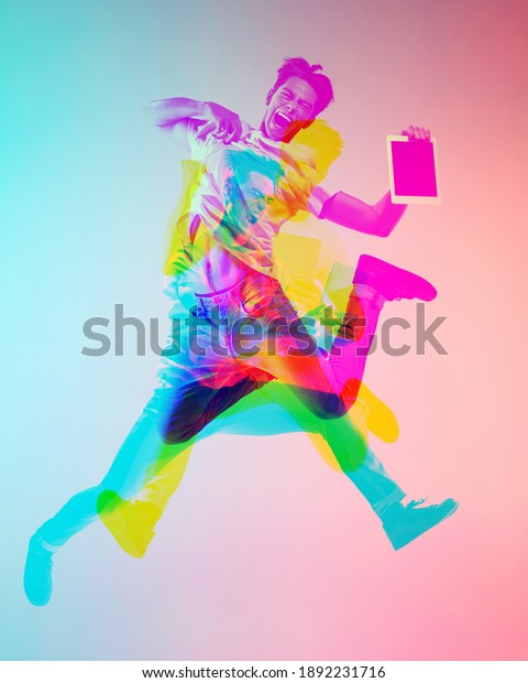Jumping high. Multiple portrait with glitch
duotone effect. Multiple exposure, abstract fashionable beauty
photo. Young beautiful male model posing. Youth culture, composite
image, fashionable
people.