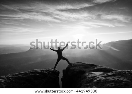 Similar – photographer in mountain at sunset