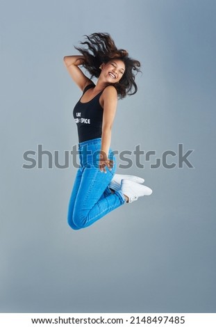 Similar – Young mixed woman with afro hair jumping outdoors.