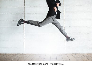 Jumping Man In The Black Suit In The Office