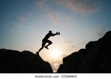 The jumping man on rocks