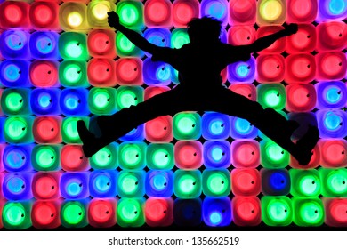 Jumping up on the colorful light background - Shutterstock ID 135662519