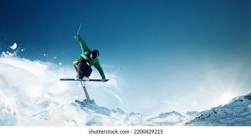 Jumping skier skiing in high mountains	 - Powered by Shutterstock