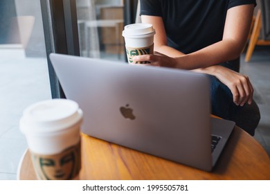Jun 16th 2021 : A Woman Drinking Starbucks Coffee While Working On Apple MacBook Pro Laptop, Chiang Mai Thailand