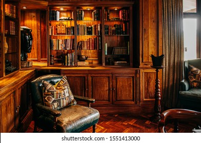 JUN 19, 2011 Serengeti, Tanzania - Luxury African Safari Lodge Reading Room  Interior With Old Vintage Leather Armchairs Under Warm Light And Antique Books Decoration