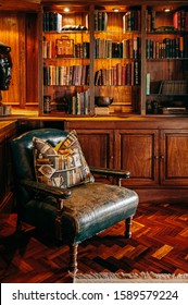 JUN 19, 2011 Serengeti, Tanzania - Luxury African Safari Lodge Reading Room  Interior With Old Vintage Leather Armchairs Under Warm Light And Antique Books Decoration