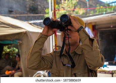 Junagadh, Gujarat, India - March 7, 2016: A Police Personnel Keep A Watch On Devotees Arriving In The City For Mahashivratri Festival. 