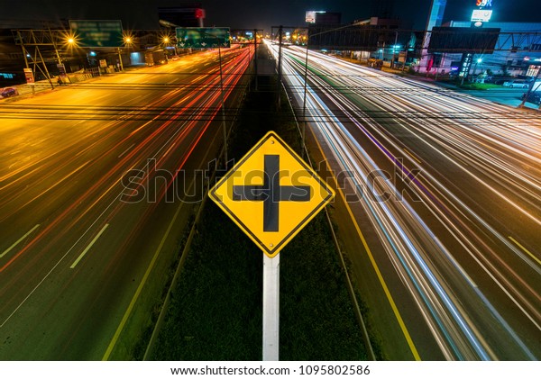 Junction sign on the street background\
Crossroads on the streetlight Car line\
clipingpart