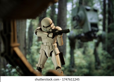 JUNE 1 2020: scene from Star Wars Return of the Jedi with an Imperial Stormtrooper firing his E-11 blaster on the forest moon of Endor - Hasbro action figure