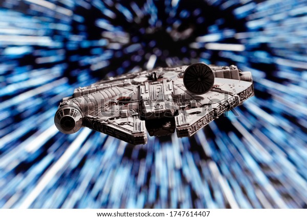 JUNE 1 2020:  Star Wars\
Millennium Falcon flying through hyperspace - X-Wing miniature game\
piece