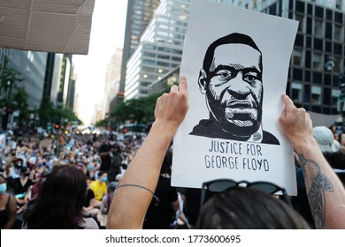 June 10, 2020 People holding a portrait  of George Floyd during the Black Lives Matter Protest heading to the Mayor's house Gracie Mansion, New York City, USA