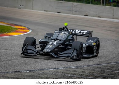 June 11, 2022 - Plymouth, WI, USA: KYLE KIRKWOOD (14) (R) of Jupiter, Florida prepares to practice for the Sonsio Grand Prix at Road America at Road America in Plymouth WI.