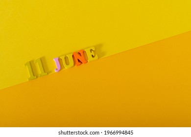 June 11, Wooden Letters And Numbers On A Yellow Background. The Concept Of King Kamehameha Day.