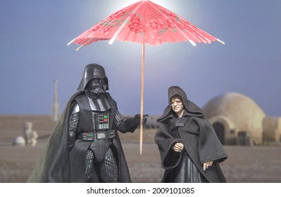 JUNE 12 2021: Humor Image, Star Wars Sith Lord Darth Vader And Emperor Palpatine On Tatooine With Sun Umbrella - Hasbro Action Figure