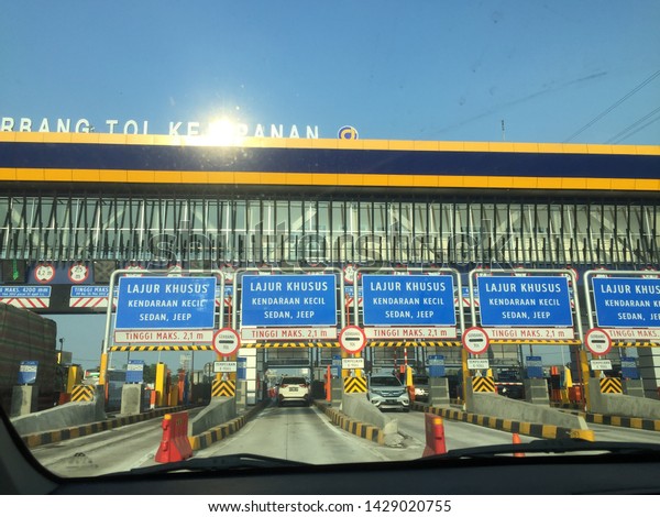 June 19, 2019 - toll road, Indonesia.\
choosing the toll road accelerates the journey, avoiding traffic\
jams returning home, the drivers pass the toll\
road
