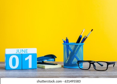 June 1st. Day 1 Of Month, Calendar On Business Office Table, Workplace At Yellow Background. Summer Time