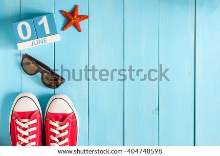 June 1st. Image of june 1 wooden color calendar on blue background.  First summer day. Empty space for text. Happy Childrens Day