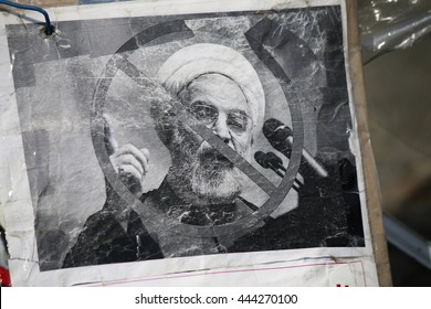 JUNE 2016 - BERLIN: a protest poster with a portrait of Iranian President Hassan Rohani (Rouhani) at a demonstration against Iranian human rights violations at the Pariser Platz in Berlin. 