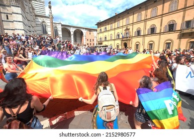 June 2018- People Holding Peace Flag During The Gay Pride Parade In Siena, Italy 