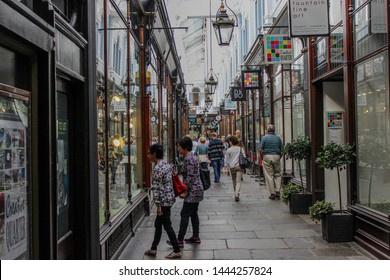 June 2019, Cardiff, Wales. People Walking Through Morgan Quarter, Shopping Arcade Started In 1896. Harvey Jones Kitchens Shop.