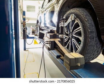 June 2022, Jakarta Indonesia, Standing Car With Sensors On Wheels For Wheel Camber Alignment Check At Service Station Workshop.