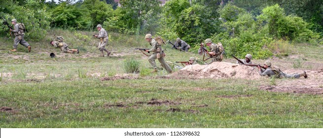 June 22 2018 St Joseph MI USA ; Soldiers In Vintage Uniforms From The Korean And Vietnam War, Act In A Mock Battle During This Reenactment Event During 'least We Forget'