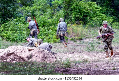 June 22 2018, St Joseph MI USA ; Soldiers In Uniform Recreate A Battle In Vintage Uniforms From Vietnam And Korean War Era In The Lest We Forget Event