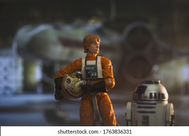 JUNE 23 2020: Scene From Star Wars With Luke Skywalker And Droid R2D2 Ready To Board His X Wing Star Fighter - Hasbro Action Figure