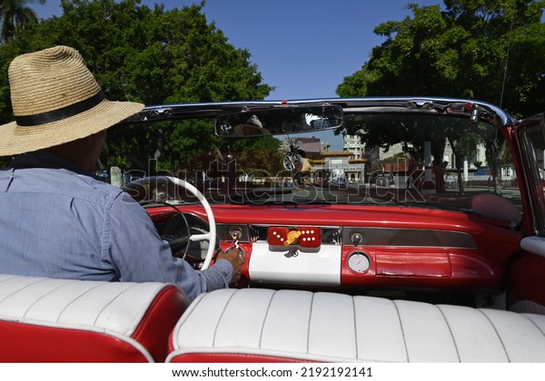 June 23, 2022. Sightseeing in the neighborhood of Vedado\
on a vintage American convertible car with a local driver in\
Havana, Cuba. 